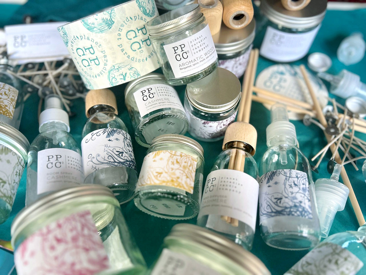 Collection of candles in jars, various sizes